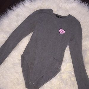 I am selling an adorable grey bodysuit.